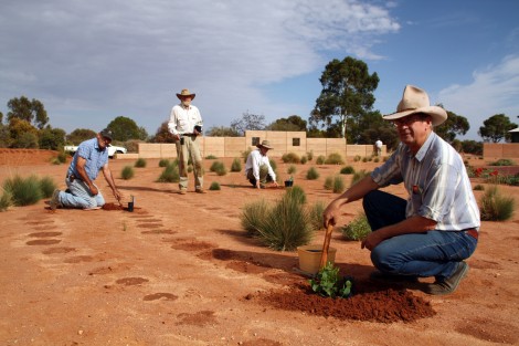 Friends of the AALBG assisting Bernie Haase in planting the area near the sundial